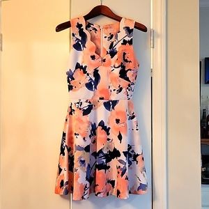 Polyester floral sleeve less dress .it's short .